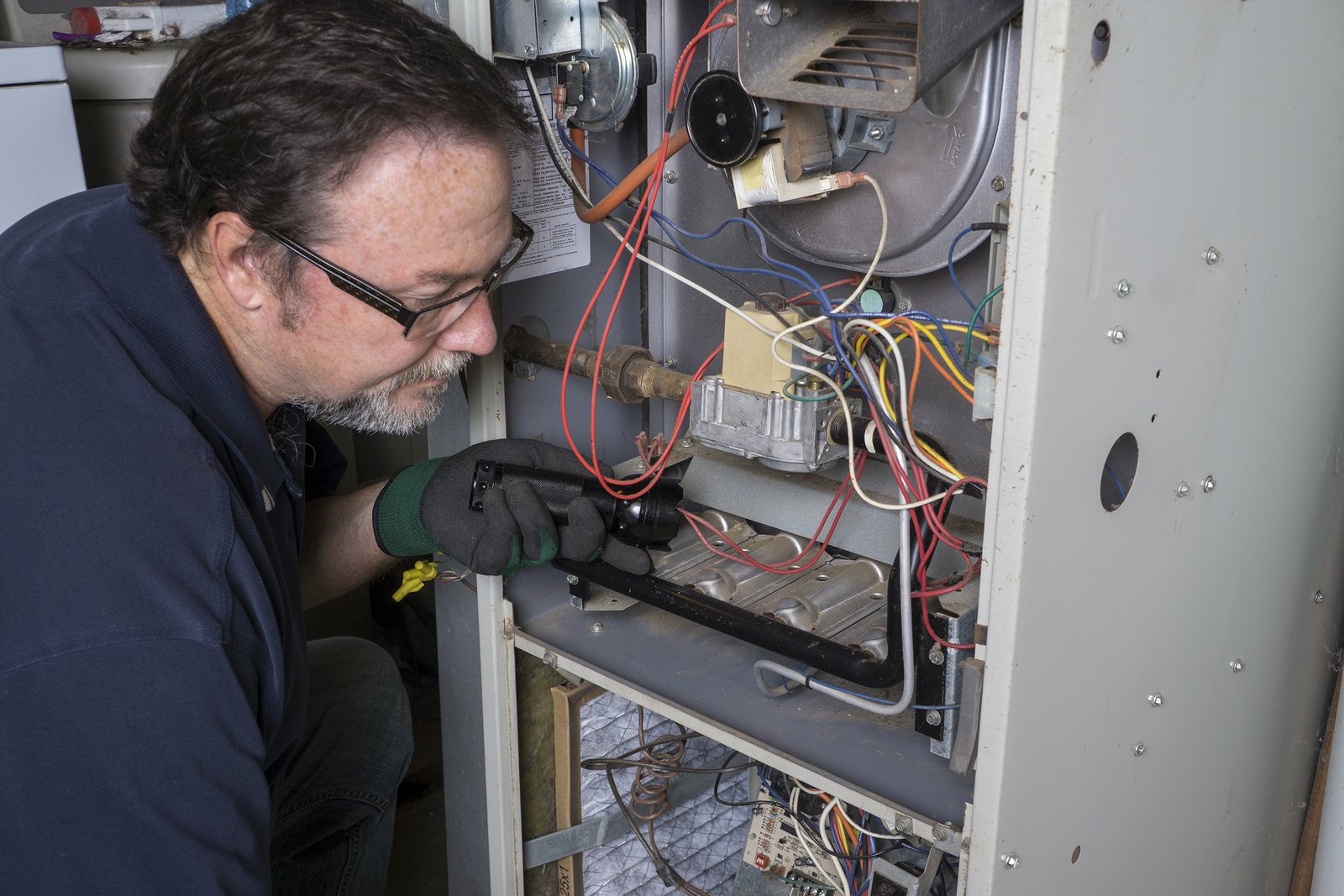 Man repairing a furnace