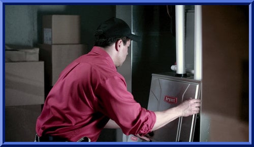 Expert technician repairing a furnace in Maysville, IA