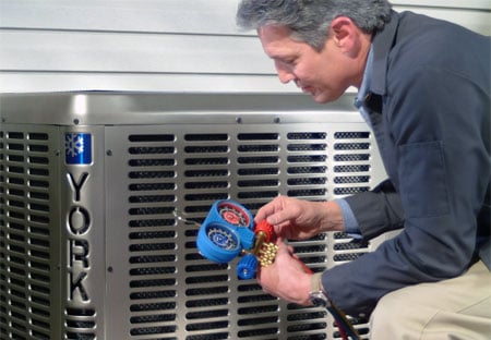 Man installing an ac unit outside